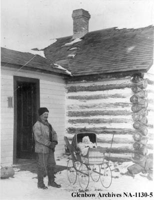 Charles Perrenoud and daughter Emma outside of the ranch 1904.