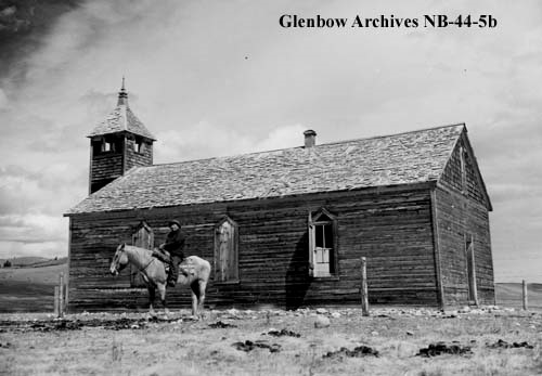 Walking Buffalo seated on a horse beside the McDougall Methodist Church at Morley, Alberta, 28th April 1952.