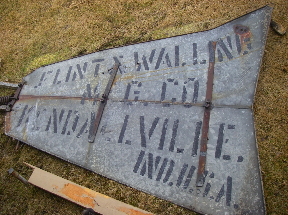 The detached tail vane of the Springbank Hill Star windmill with the Flint & Walling stamp.