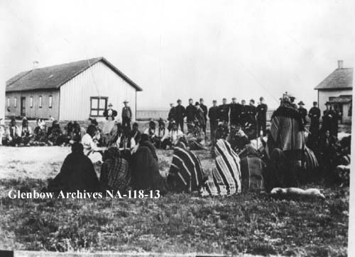 Blood pow-wow at North-West Mounted Police barracks, Fort Macleod, Alberta, June 28, 1898.