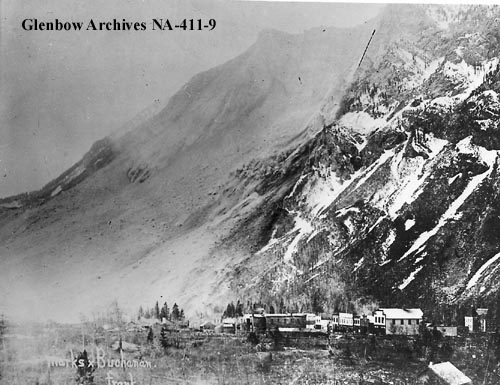 Just after the slide, town visible at the bottom and the dust is still settling. Date: 1903.