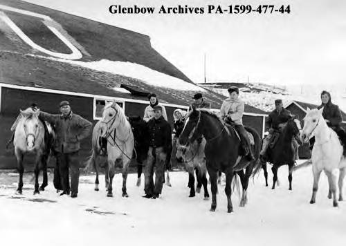 J. Allan Baker family and cowboys on Bar U Ranch, Pekisko, Alberta, 1958-12-13, from the Calgary Herald.