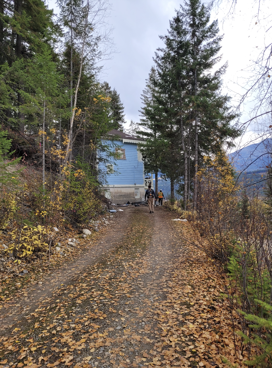 Looking up at the blue chalet from the driveway during documentation and renovations, October 2023. From Capture2Preserv project.