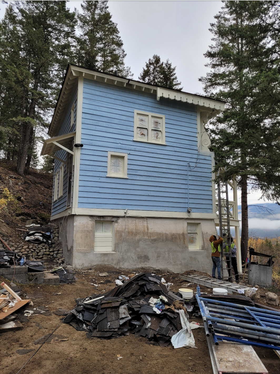 Looking up at the blue chalet from the driveway during documentation and renovations, October 2023. From Capture2Preserv project.