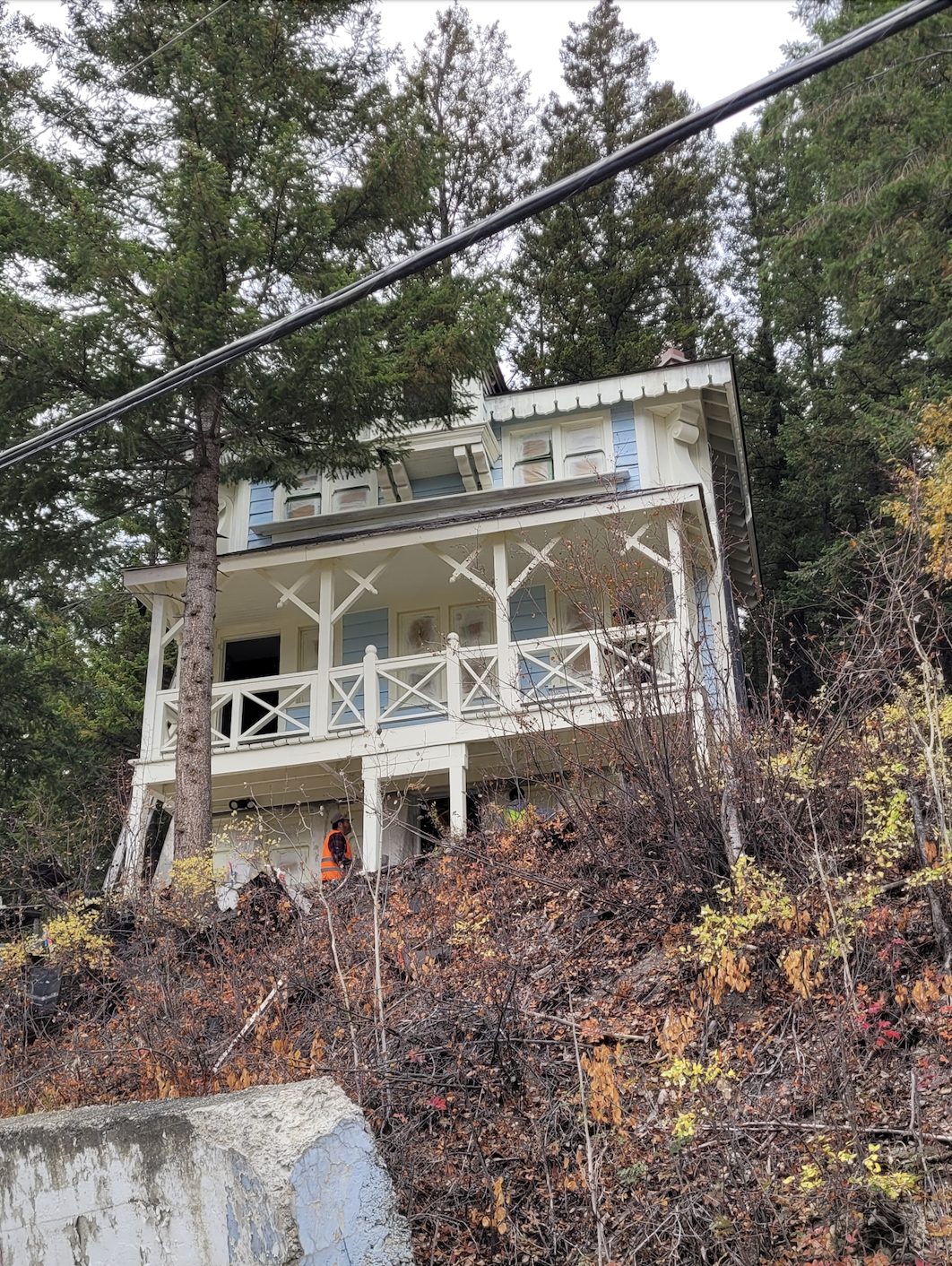 Looking up at the blue chalet from the entrance to the Swiss village. During documentation and renovations, October 2023. From Capture2Preserv project.