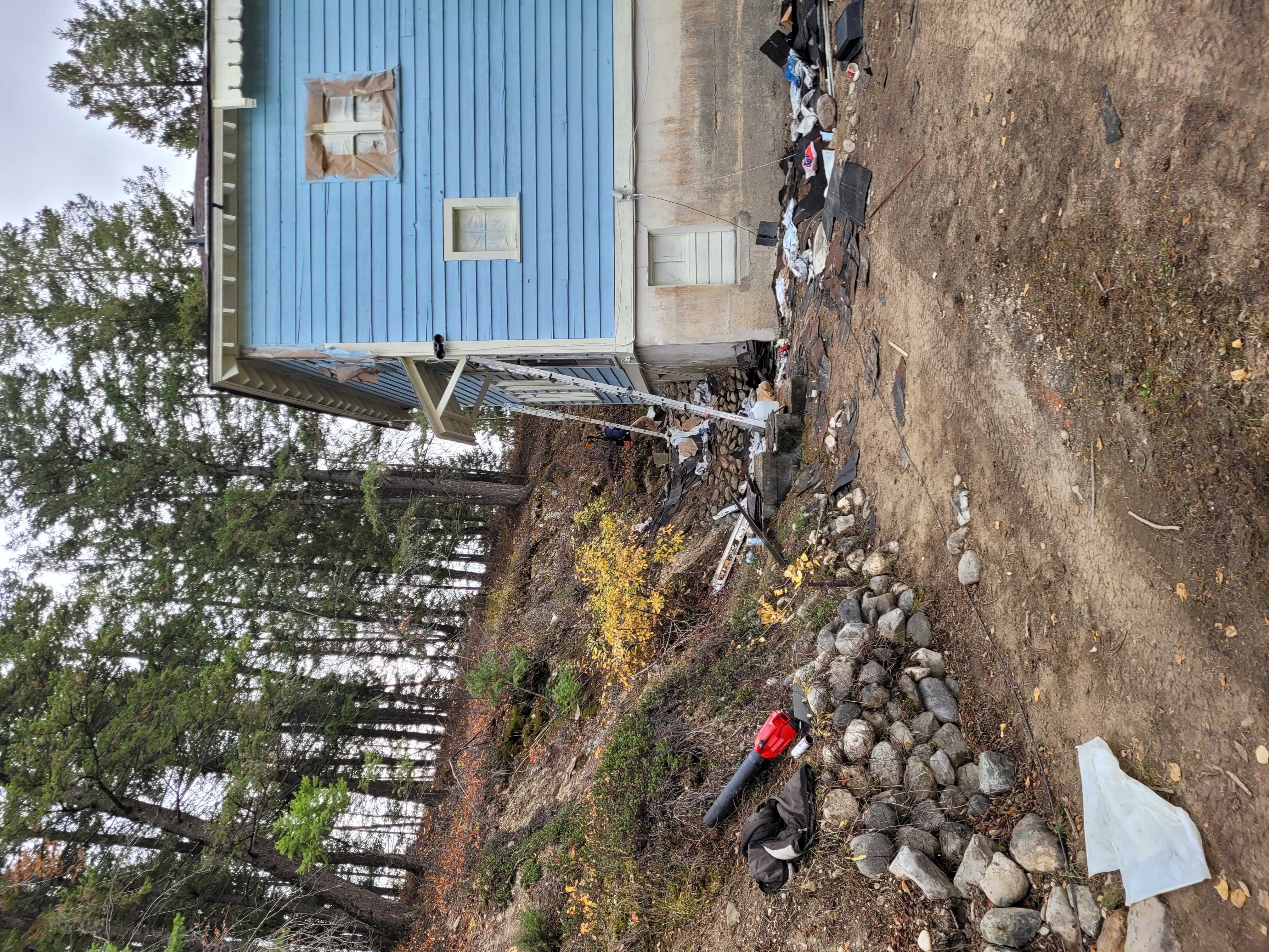 Looking up at the blue chalet from the driveway during documentation and renovations, October 2023. From Capture2Preserv project.