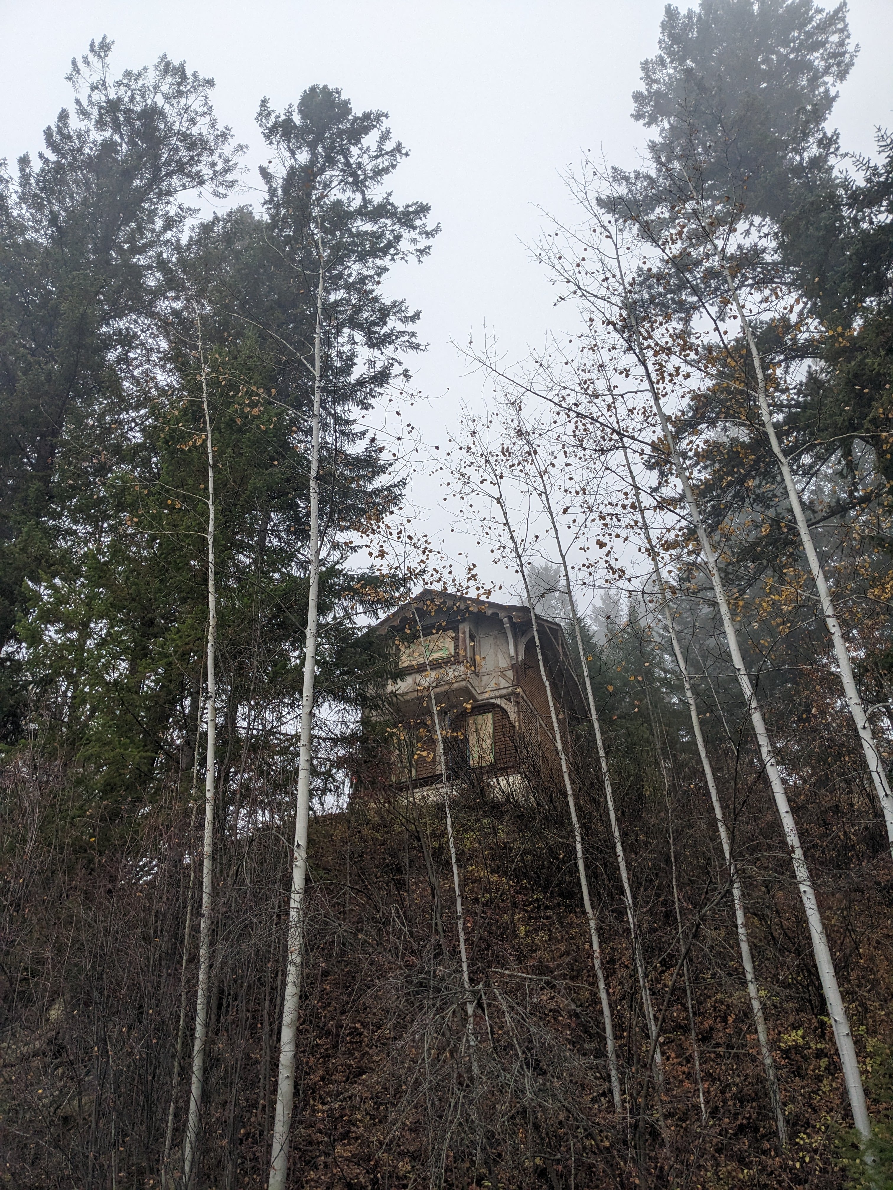 Looking at the brown chalet from the entrance to the Swiss Village. During documentation and renovations in October 2023. From Capture2Preserv project.