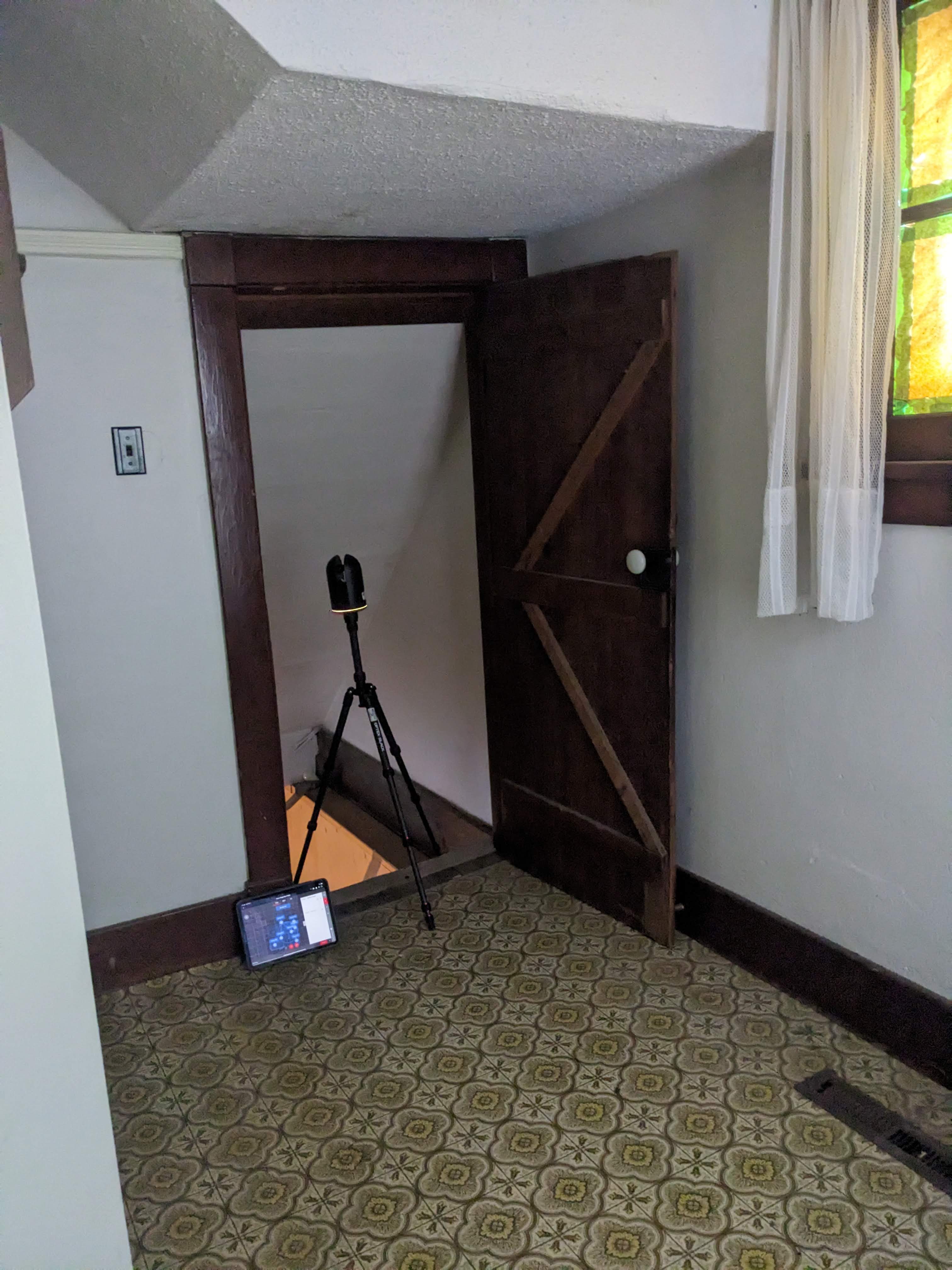 Stairs to the basement in the front entrance of the blue chalet during documentation and renovations in October 2023. From Capture2Preserv project.