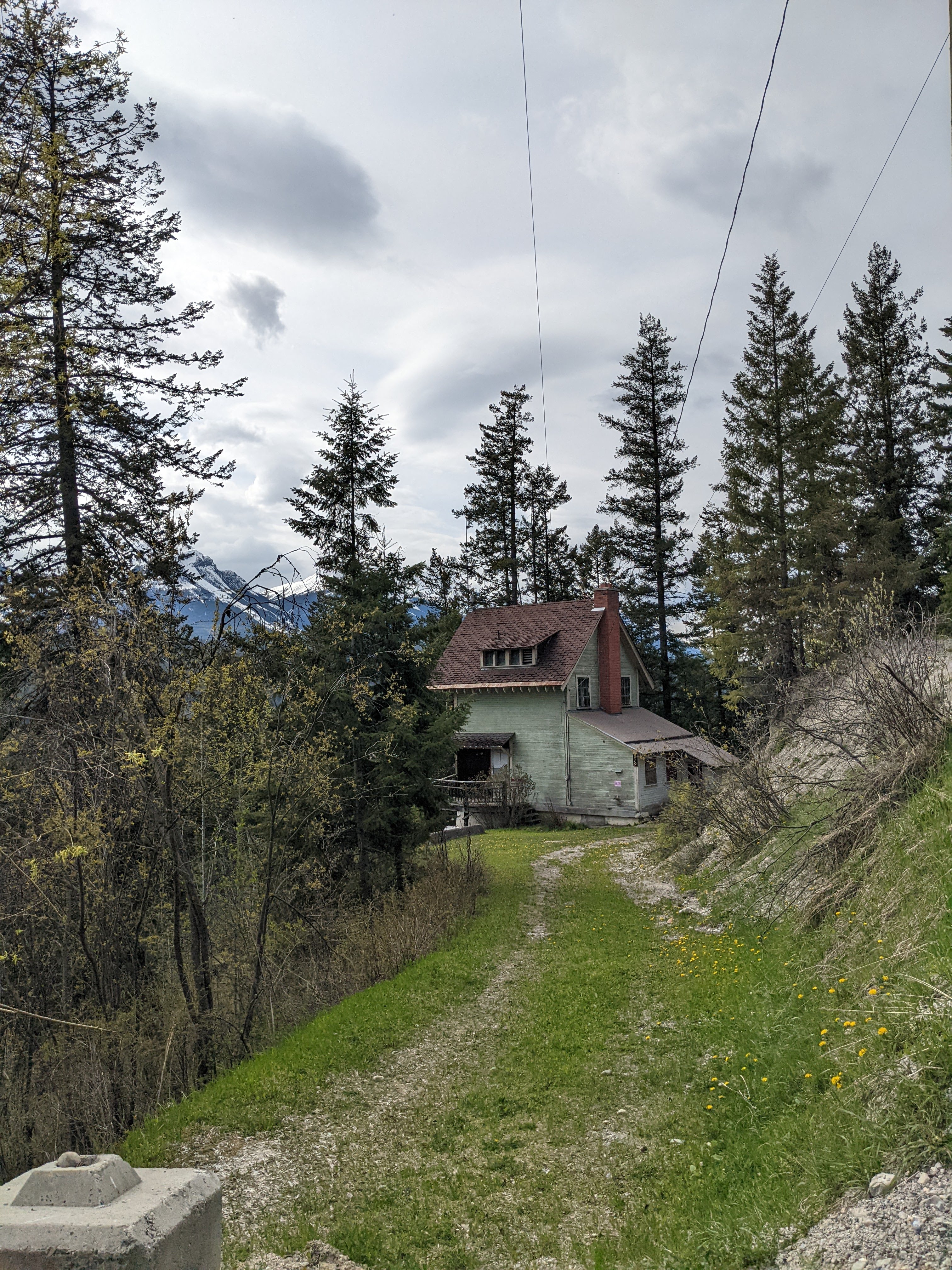 Ernst Feuz's chalet from the end of the driveway during documentation of the Edward Feuz chalet, May 2022.  From Capture2Preserv project.