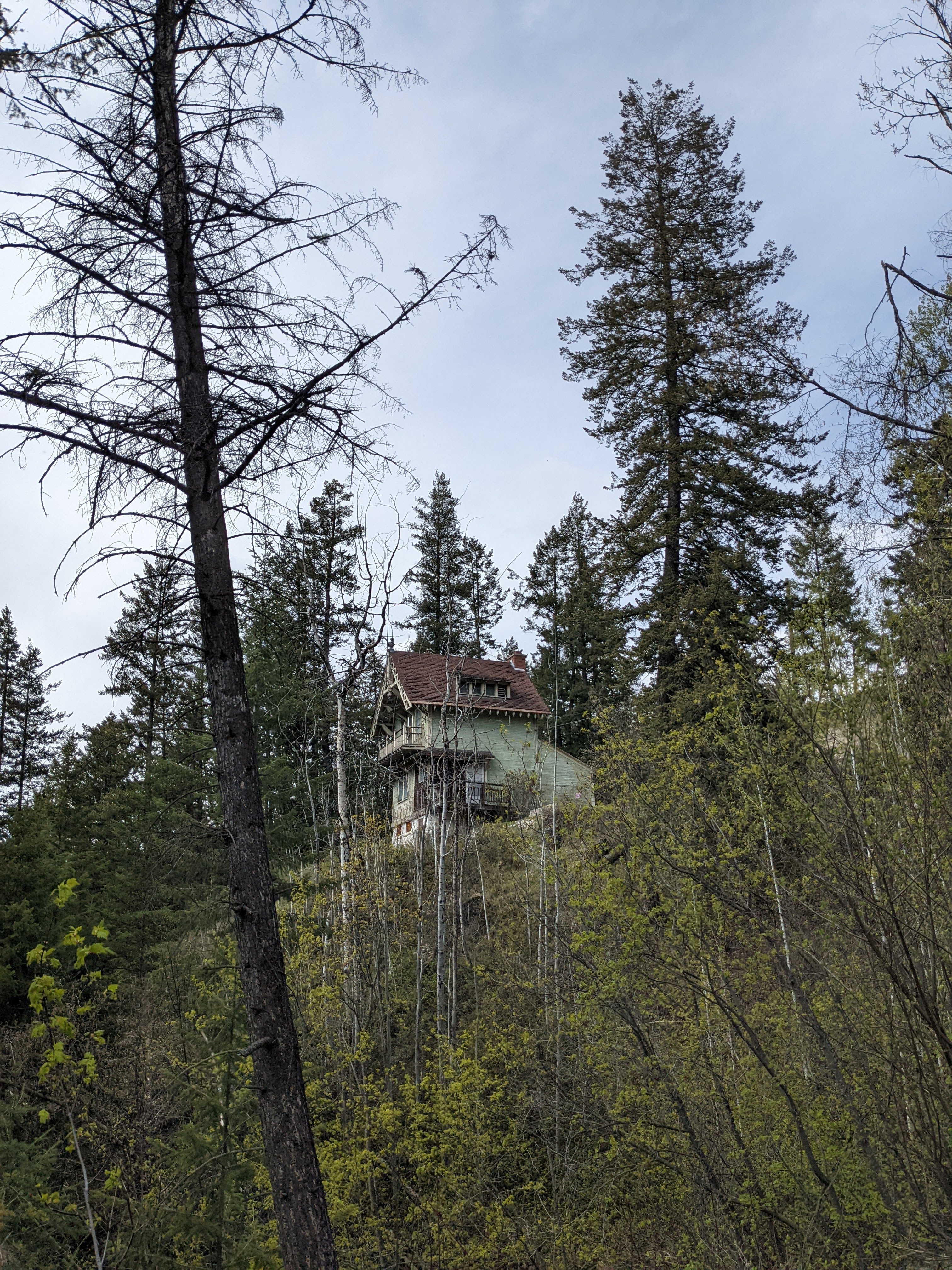 View of Ernst Feuz's chalet from the road into the Swiss Village. During documentation of the Edward Feuz chalet, May 2022.  From Capture2Preserv project.