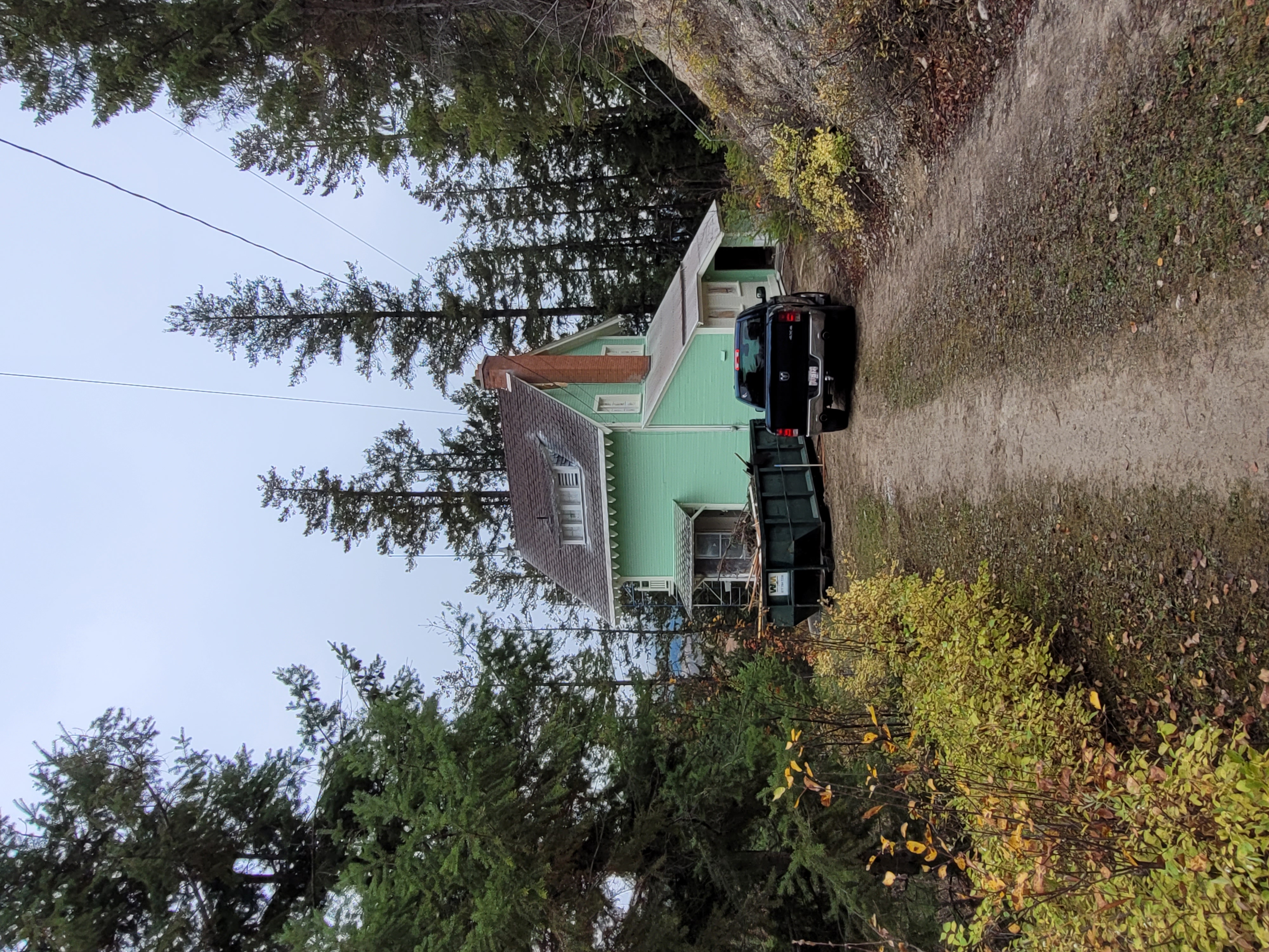 Ernst Feuz's chalet from the end of the driveway during documentation and renovations, October 2023.  From Capture2Preserv project.