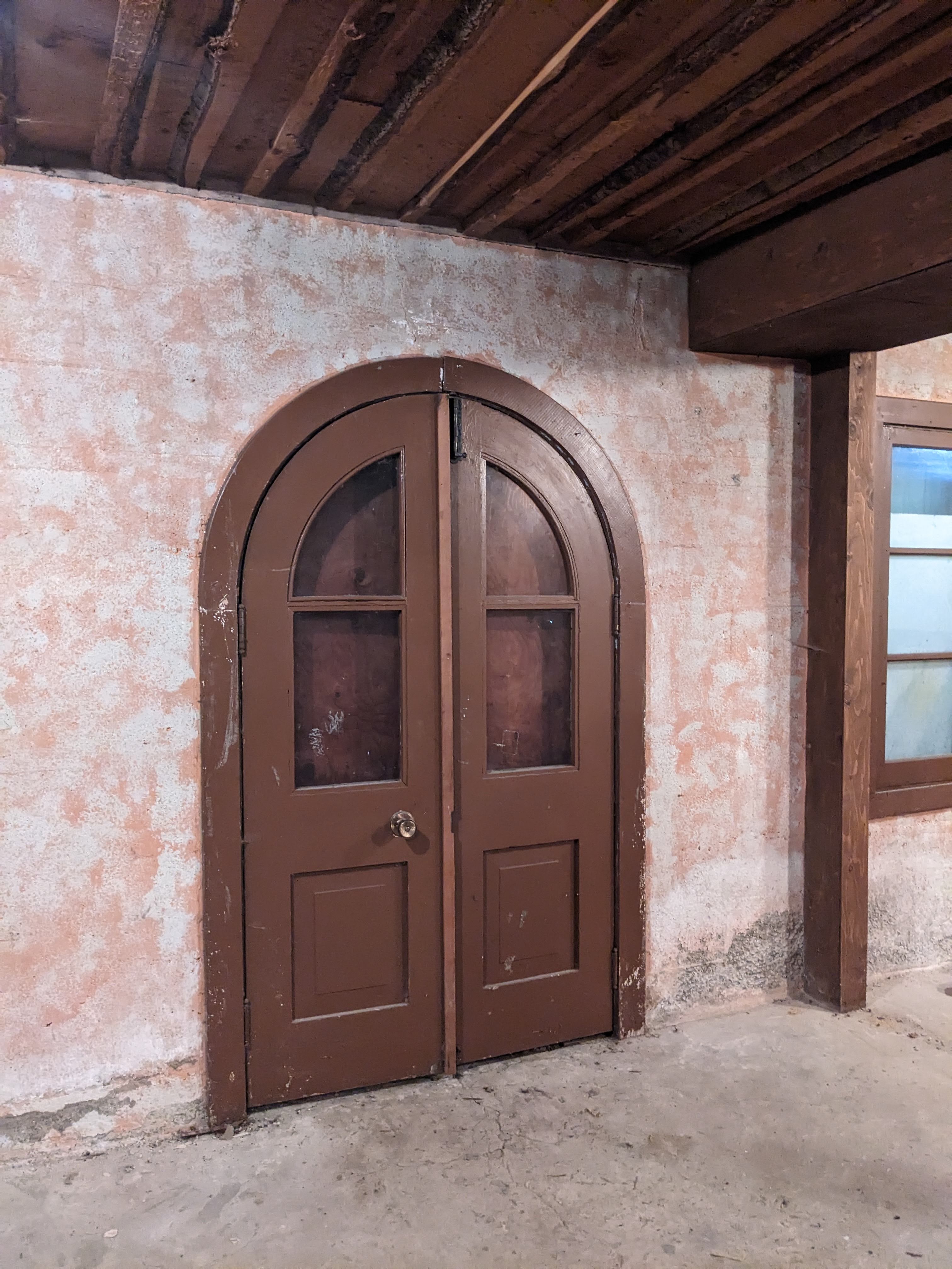 Rounded basement door of Christian Haesler chalet. During documentation and renovations, October 2023. From Capture2Preserv project.