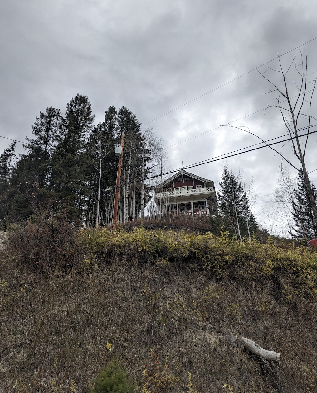 View up to Edward Feuz's chalet from the entrance to the sunflower chalet. During documentation and renovations in October 2023. From Capture2Preserv project.