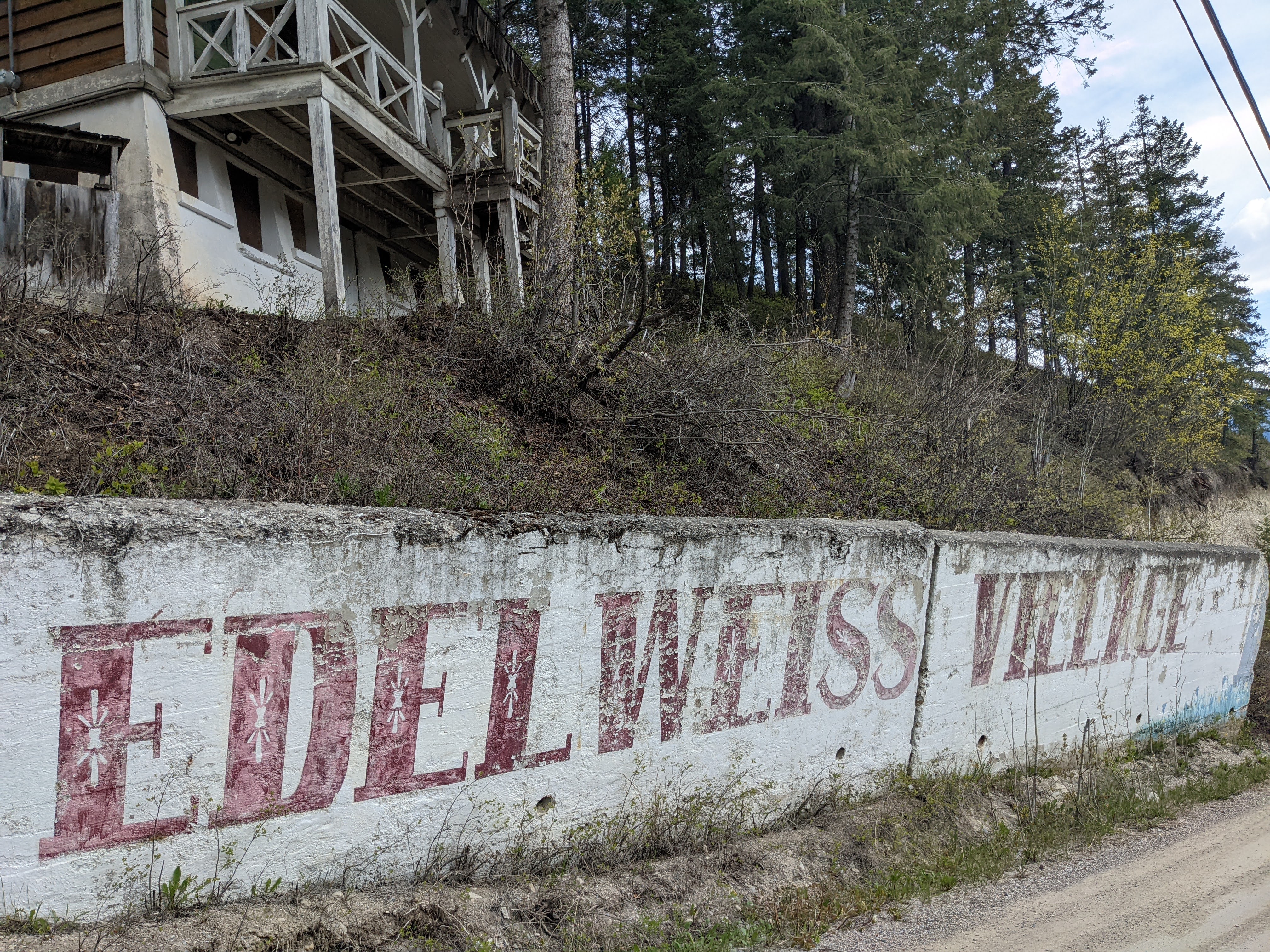 Edelweiss Village entrance sign, part of the blue chalet in top left corner. During documentation and renovations in October 2023. From Capture2Preserv project.