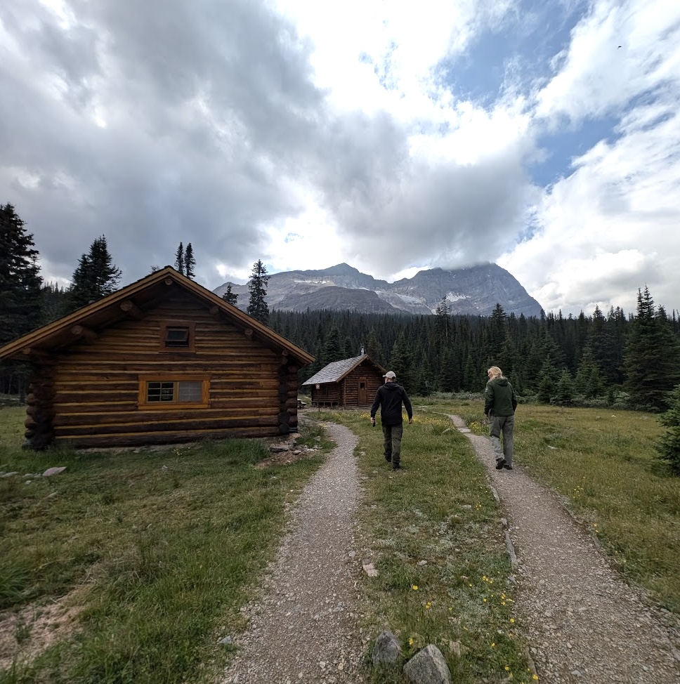 Walking up to the Elizabeth Parker Hut and Wiwaxy Lodge on a site visit after documenting the Lake O'Hara Warden Cabin on August 13, 2024. Photo from Capture2Preserv project.